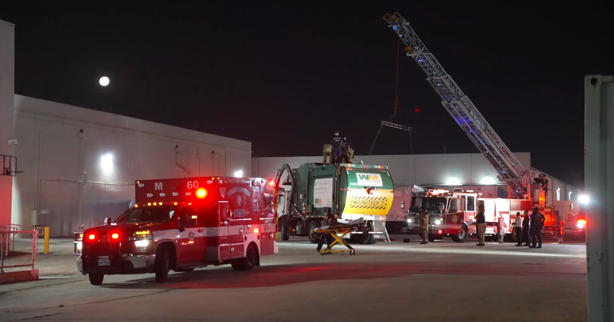 Houston man trapped inside garbage truck rescued by firefighters