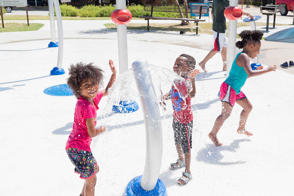 Children playing in water at Brantley Hinshaw Park splash pad