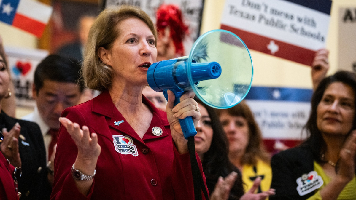 Texas Rep. Vikki Goodwin, D-Austin, speaks to protesters in the Capitol Rotunda during a rally.