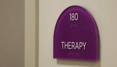 A purple sign reads "Therapy" in white block lettering.