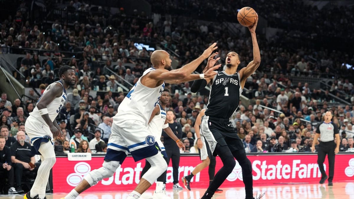 San Antonio Spurs C Victor Wembanyama pump fakes vs. the Minnesota Timberwolves during Game 5 of the 2026 Western Conference Semifinals at Frost Bank Center in Texas.
