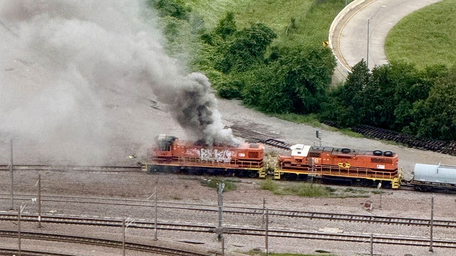 Smoke rises from a locomotive in downtown Dallas on May 6, 2026.