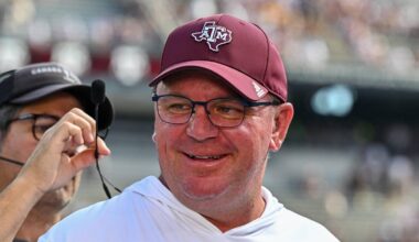 Oct 5, 2024; College Station, Texas, USA; Texas A&M Aggies head coach Mike Elko gets ready for a pre-game interview with the SEC Nation prior to the game against the Missouri Tigers at Kyle Field. Mandatory Credit: Maria Lysaker-Imagn Images.