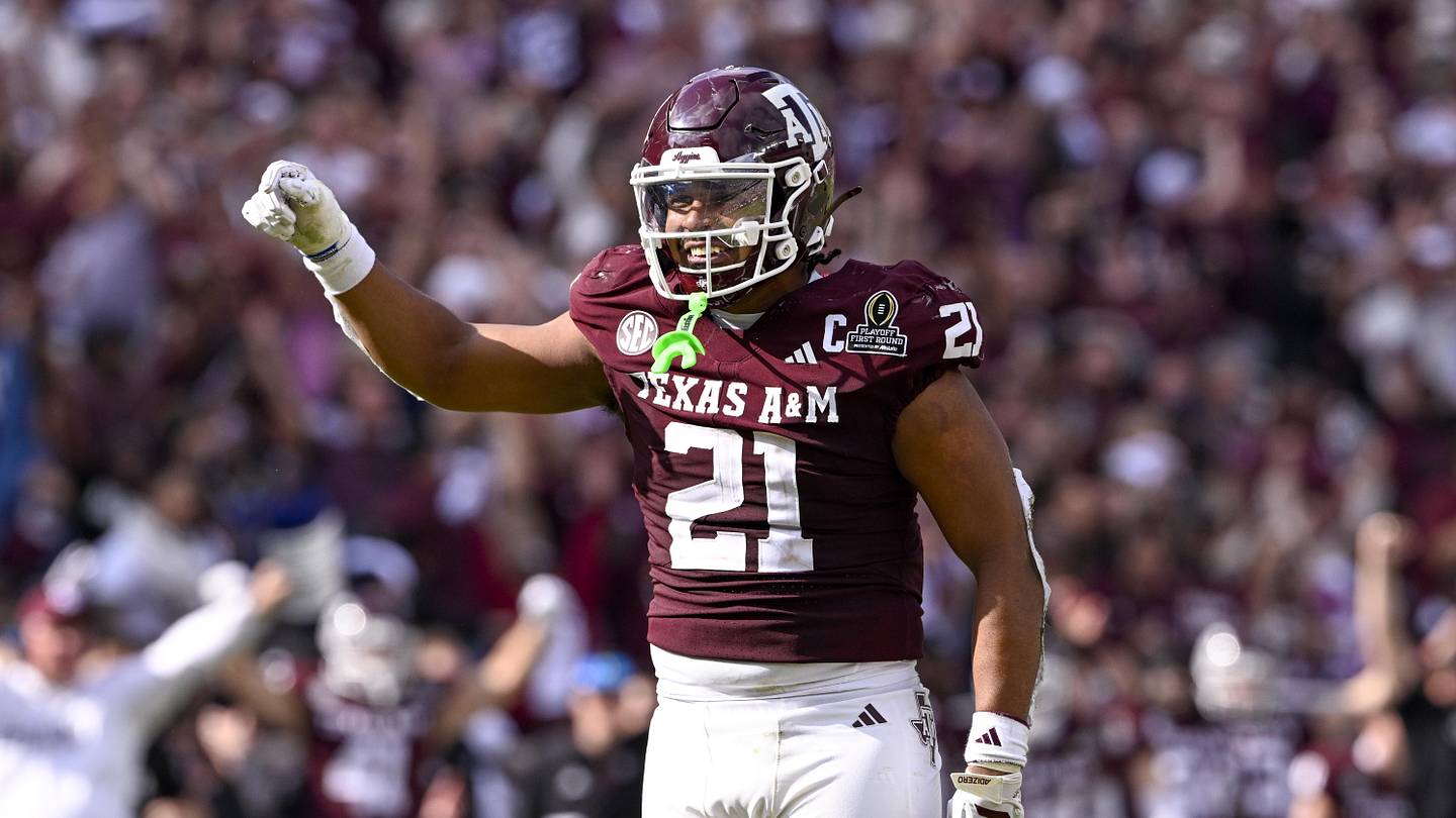 Dec 20, 2025; College Station, TX, USA; Texas A&M Aggies linebacker Taurean York (21) celebrates during the game between the Aggies and the Hurricanes at Kyle Field. Mandatory Credit: Jerome Miron-Imagn Images