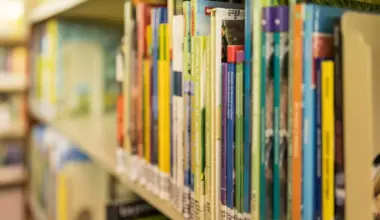 Books on a shelf at in a library.
