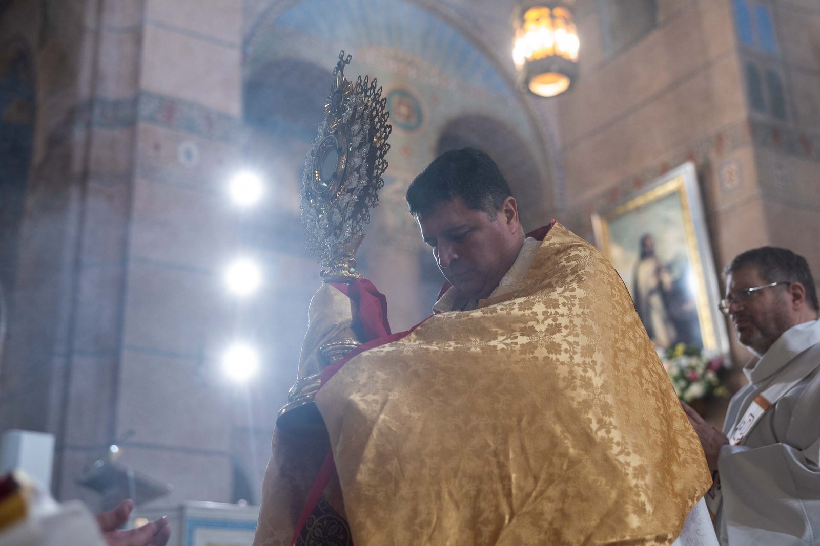 Bishop Evelio Menjivar carries the Eucharist in a monstrance as a Corpus Christ procession begins at the end of a Mass for the Solemnity of the Most Holy Body and Blood of Christ on June 7, 2026 at the Shrine of the Sacred Heart in Washington, D.C.. (Catholic Standard photo by