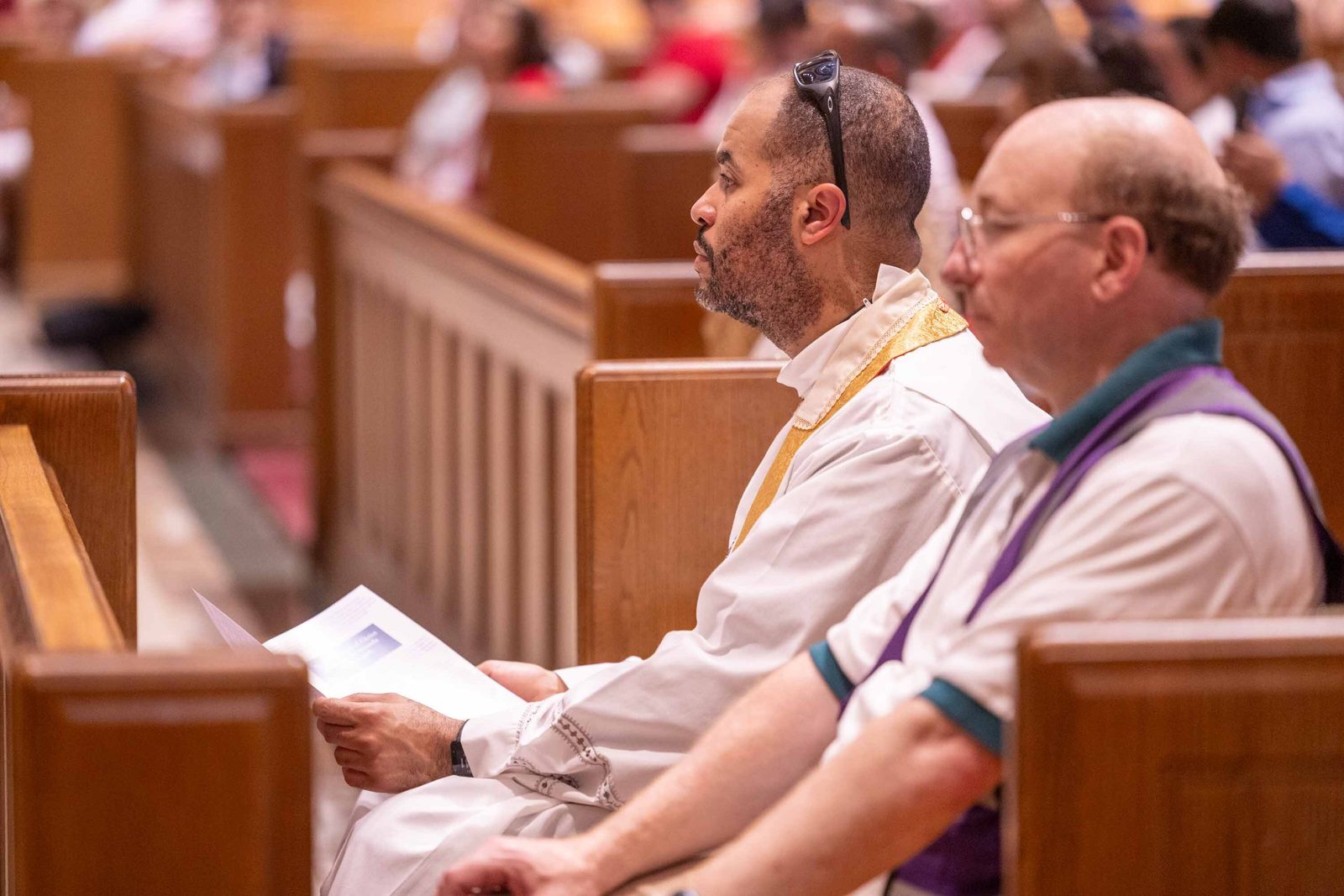 Bishop-elect Robert P. Boxie III listens during remarks by Bishop Evelio Menjívar at the Cathedral of St. Matthew the Apostle in Washington on June 7, 2026. Moments later, Bishop Menjívar told the faithful he was passing the torch to Bishop-elect Boxie — an announcement met with warm applause from the congregation. (Catholic Standard photo/Mihoko Owada)