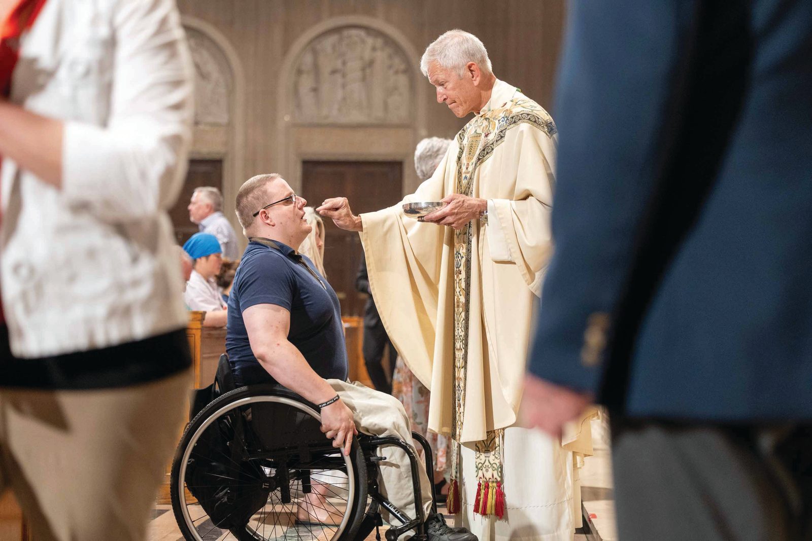 Bishop-elect Gary Studniewski distributes Holy Communion during a June 6 Vigil Mass for the Solemnity of Corpus Christi he celebrated at the Basilica of the National Shrine of the Immaculate Conception as part of the National Eucharistic Pilgrimage’s visit to the Roman Catholic Archdiocese of Washington. (Catholic Standard photo by Mihoko Owada)