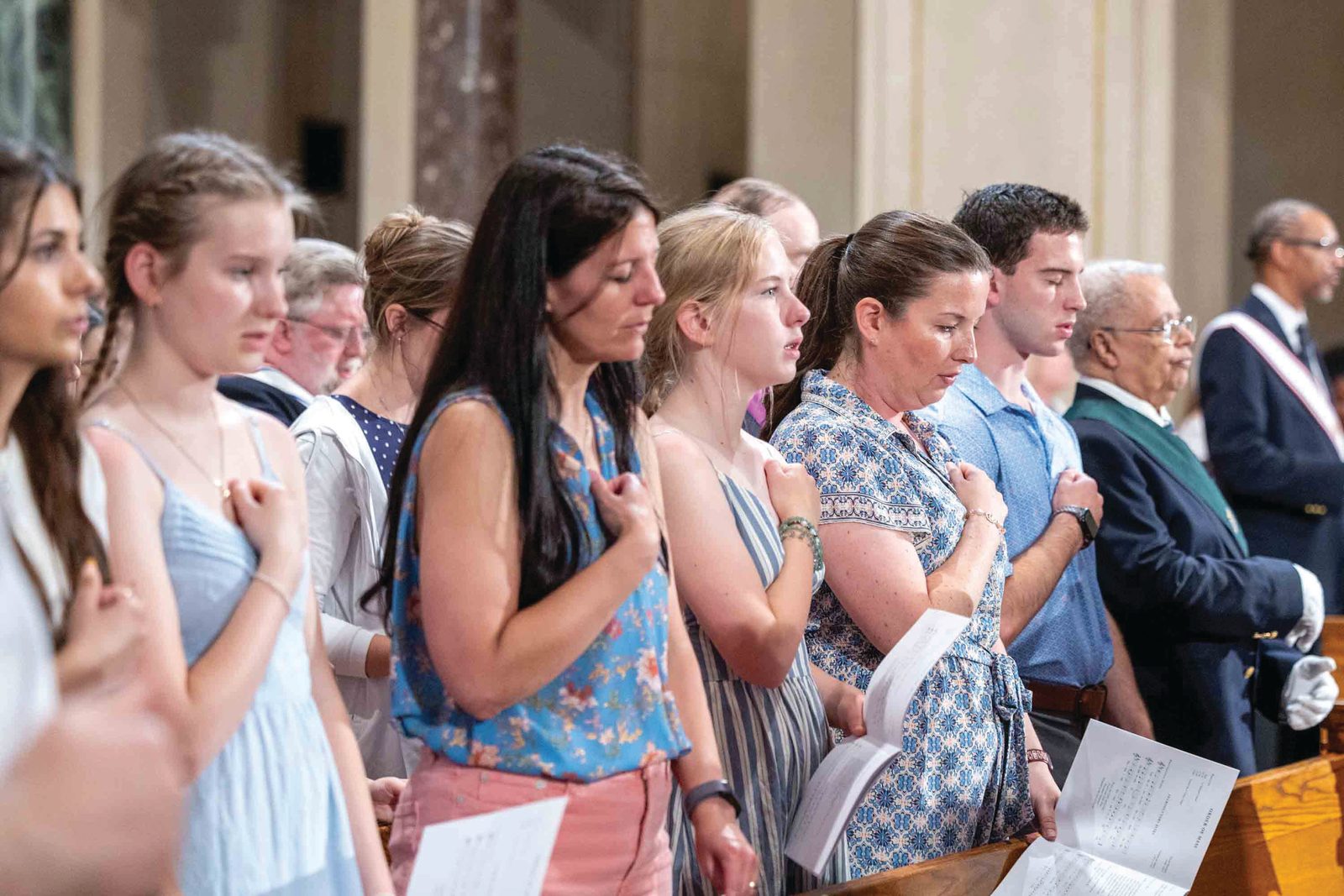 The faithful pray during a June 6 Vigil Mass for the Solemnity of Corpus Christi he celebrated at the Basilica of the National Shrine of the Immaculate Conception as part of the National Eucharistic Pilgrimage’s visit to the Roman Catholic Archdiocese of Washington. During the Mass, they were reminded that those who partake in the Eucharist “participate in the very life of Jesus – to have a share in the life of God Himself.” (Catholic Standard photo by Mihoko Owada)