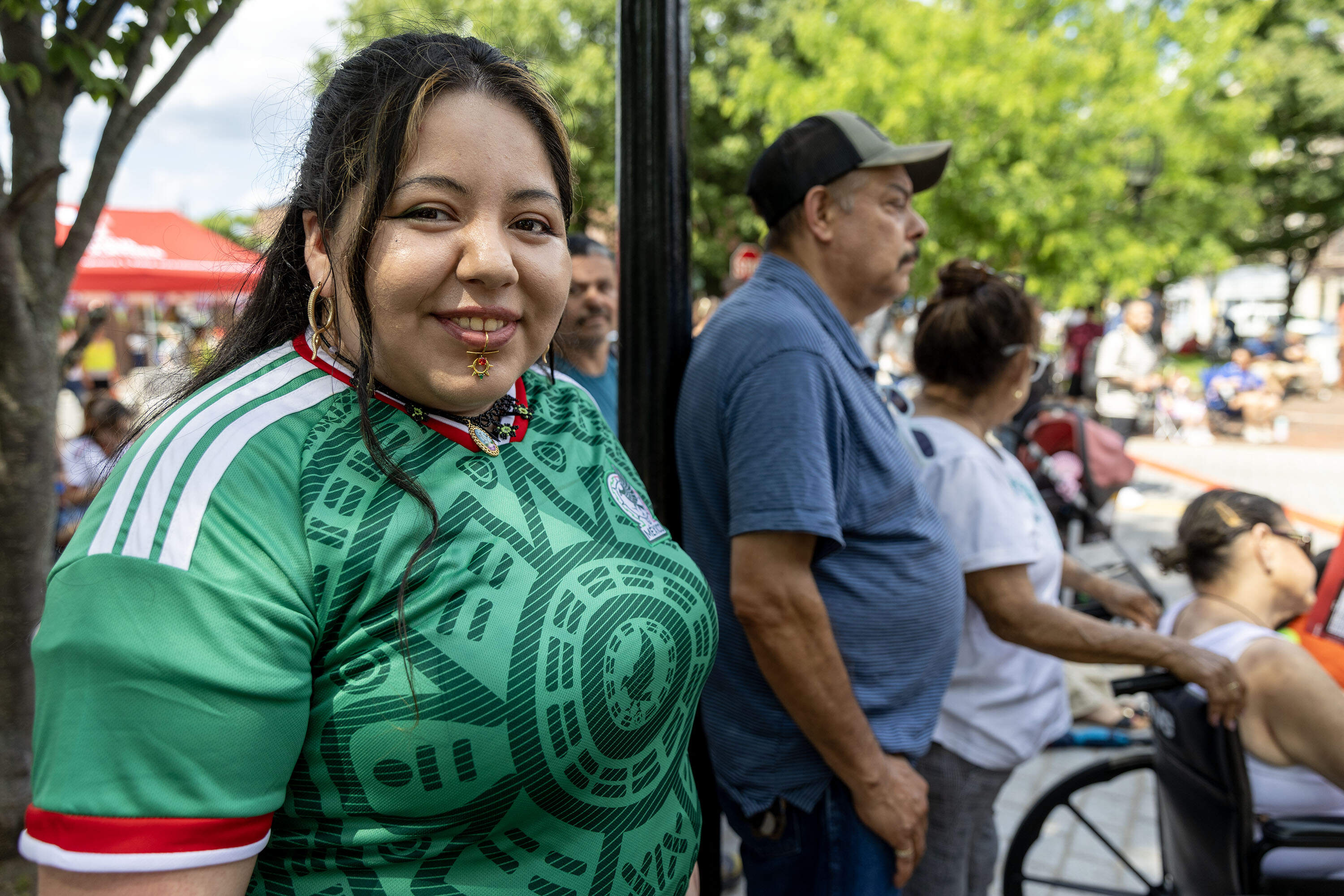 Maribel Garcia wears a Mexico jersey at the "Fiesta Futbol" in Chelsea Square. (Robin Lubbock/WBUR)