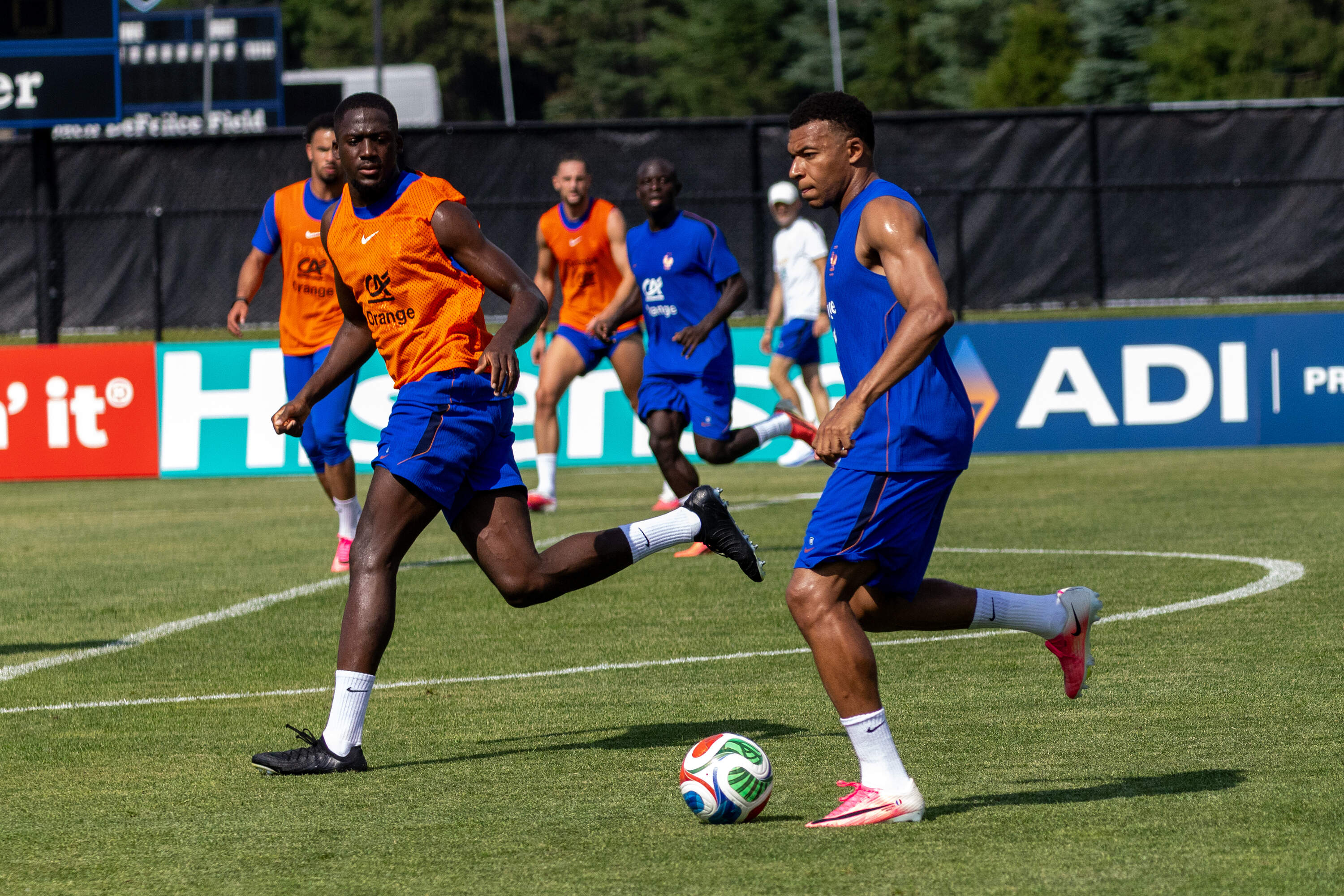 France men's national team striker Kylian Mbappé dibbles the ball during a practice Friday at Bentley University in Waltham. (Jesse Costa/WBUR)