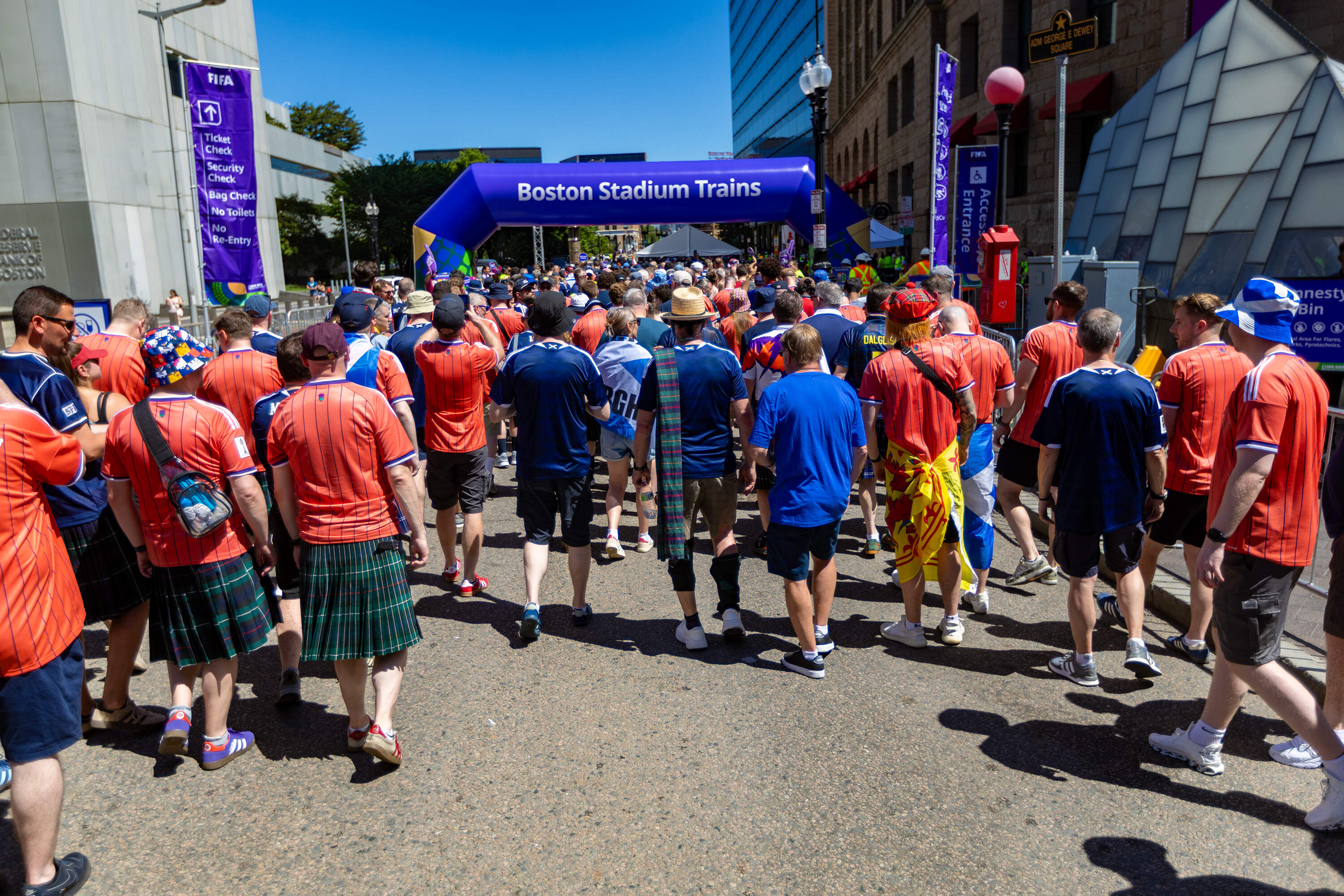 Fans file into the entryway at South Station to board trains to the first World Cup match between Scotland and Haiti from to Foxborough. (Jesse Costa/WBUR)
