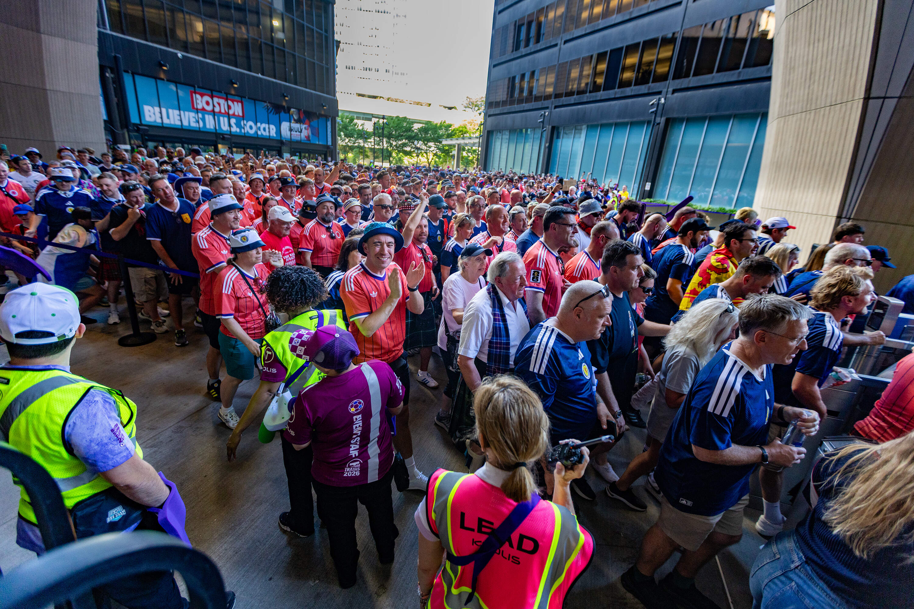 A group of fans board the first MBTA train at South Station to the first World Cup match between Scotland and Haiti in Foxborough. (Jesse Costa/WBUR)