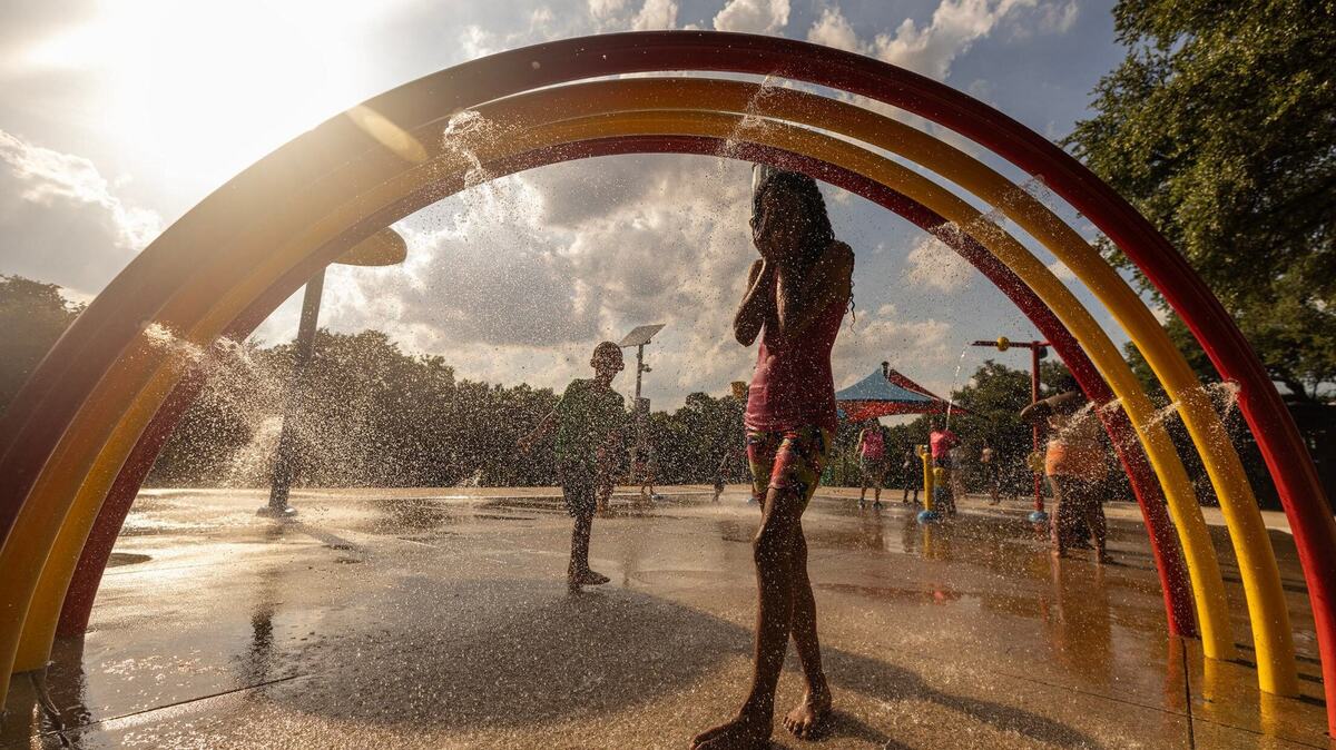 Suri Perez, 10, cools down under the water at the splash pad at Sycamore Water Park in Fort Worth on Thursday, June 27, 2024. Temperatures rose to over 100 degrees as the summer heatwave begins to heat up. Suri Perez, 10, cools down under the water at the splash pad at Sycamore Water Park in Fort Worth on Thursday, June 27, 2024. Temperatures rose to over 100 degrees as the summer heatwave begins to heat up.