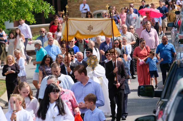 Dozens participate in a Corpus Christi procession at St. Joseph Church in Madison. 