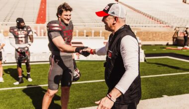 Mike Leach archived photo following a Texas Tech win at Texas A&M with cameras surrounding him postgame.