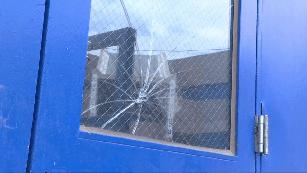 Cracked glass door of Bowie high school gym. (Credit: KFOX14/CBS4)