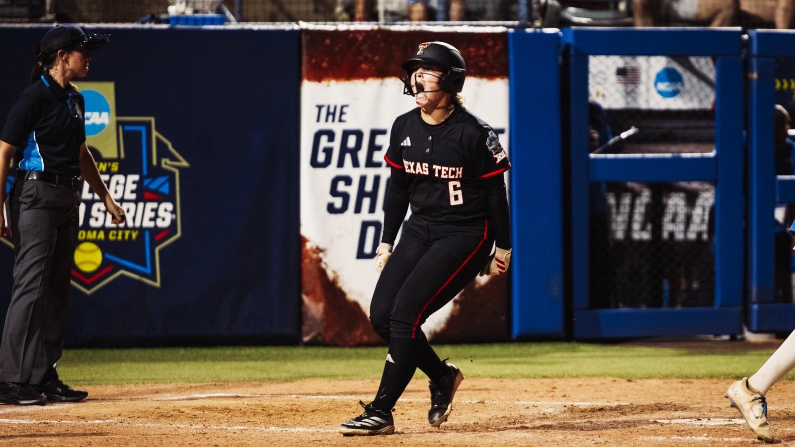 Jasmyn Burns celebrates while running the bases after hitting a home run against Alabama in the Women's College World Series.