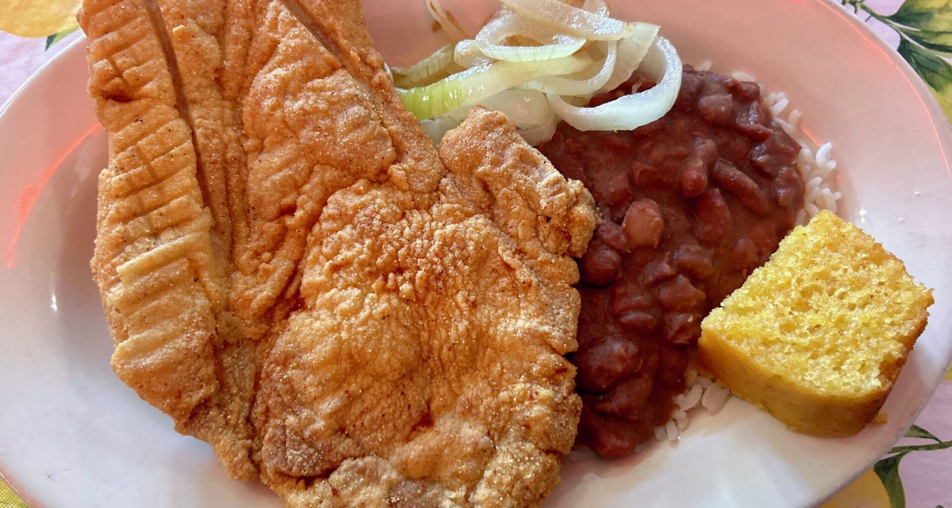 Fried pork chop with a side of rice and beans and cornbread from Ma Harper's.