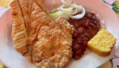 Fried pork chop with a side of rice and beans and cornbread from Ma Harper's.