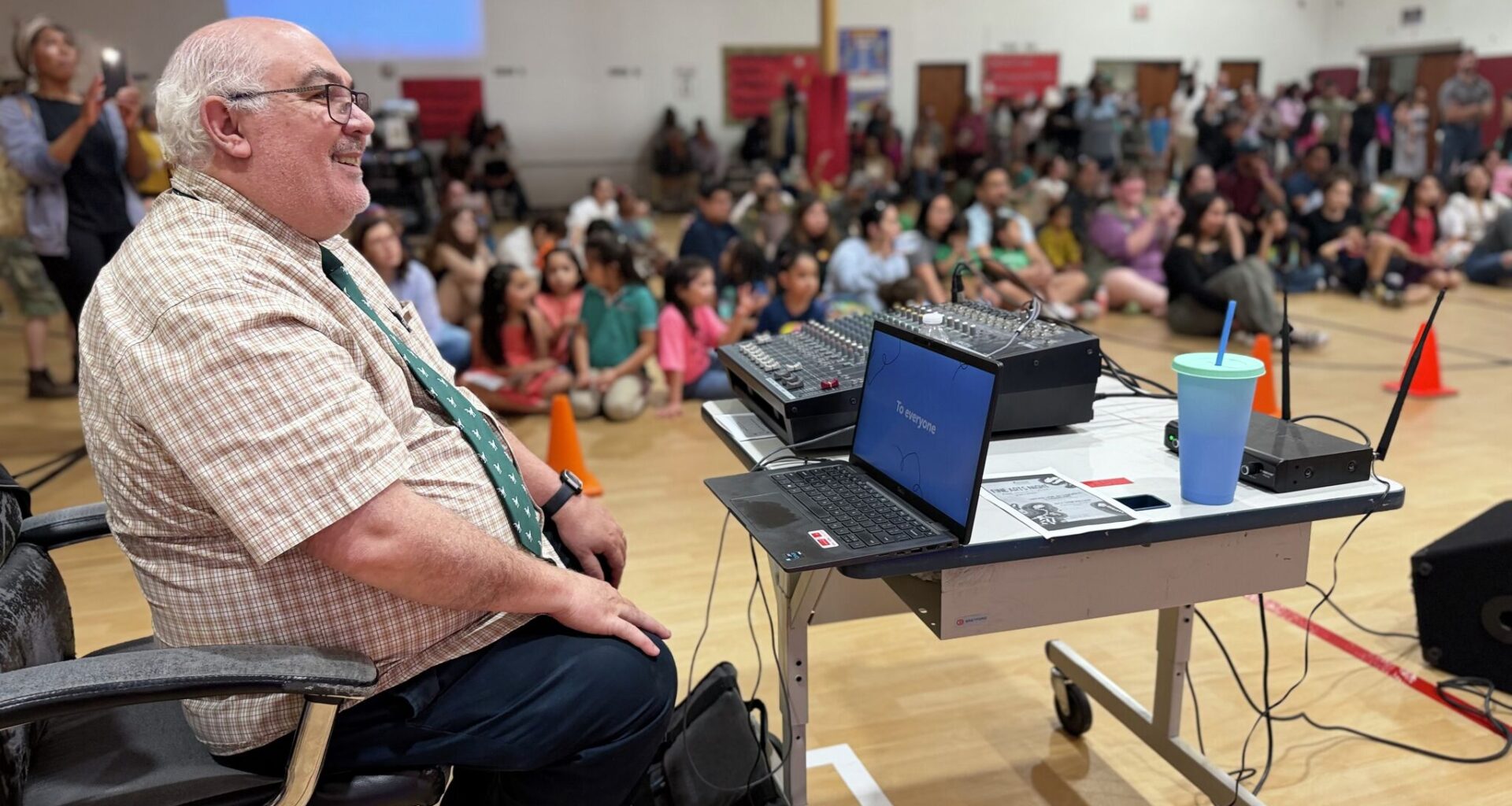 Luiz Mullini Nascimento enjoys his last music performance during a fine arts night at Harmony Science Academy. Mullini taught as a music teacher for 20 years at Harmony with perfect attendance. 