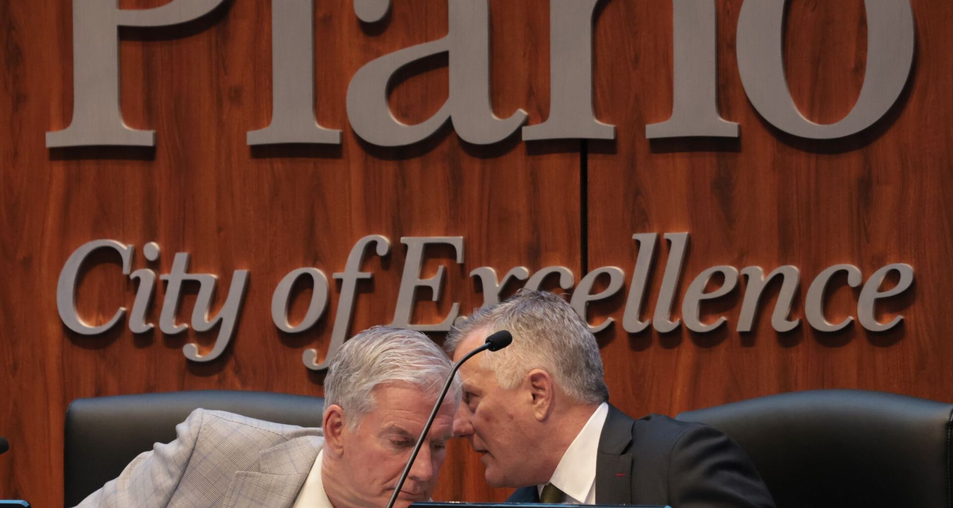 Plano City Manager Mark Israelson, right, shares information with Plano Mayor John Muns during a meeting for council members to vote on whether to approve key measures in the Dallas Stars’ proposed new arena at the Shops at Willow Bend. The meeting was conducted at the Senator Florence Shapiro Council Chambers, 1520 K Avenue in Plano, on June 8, 2026.
