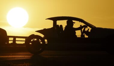 A motorist drives a Polaris Slingshot as the sun sets behind Interstate 35W near Basswood Boulevard, Wednesday, Feb. 18, 2026, in Fort Worth.