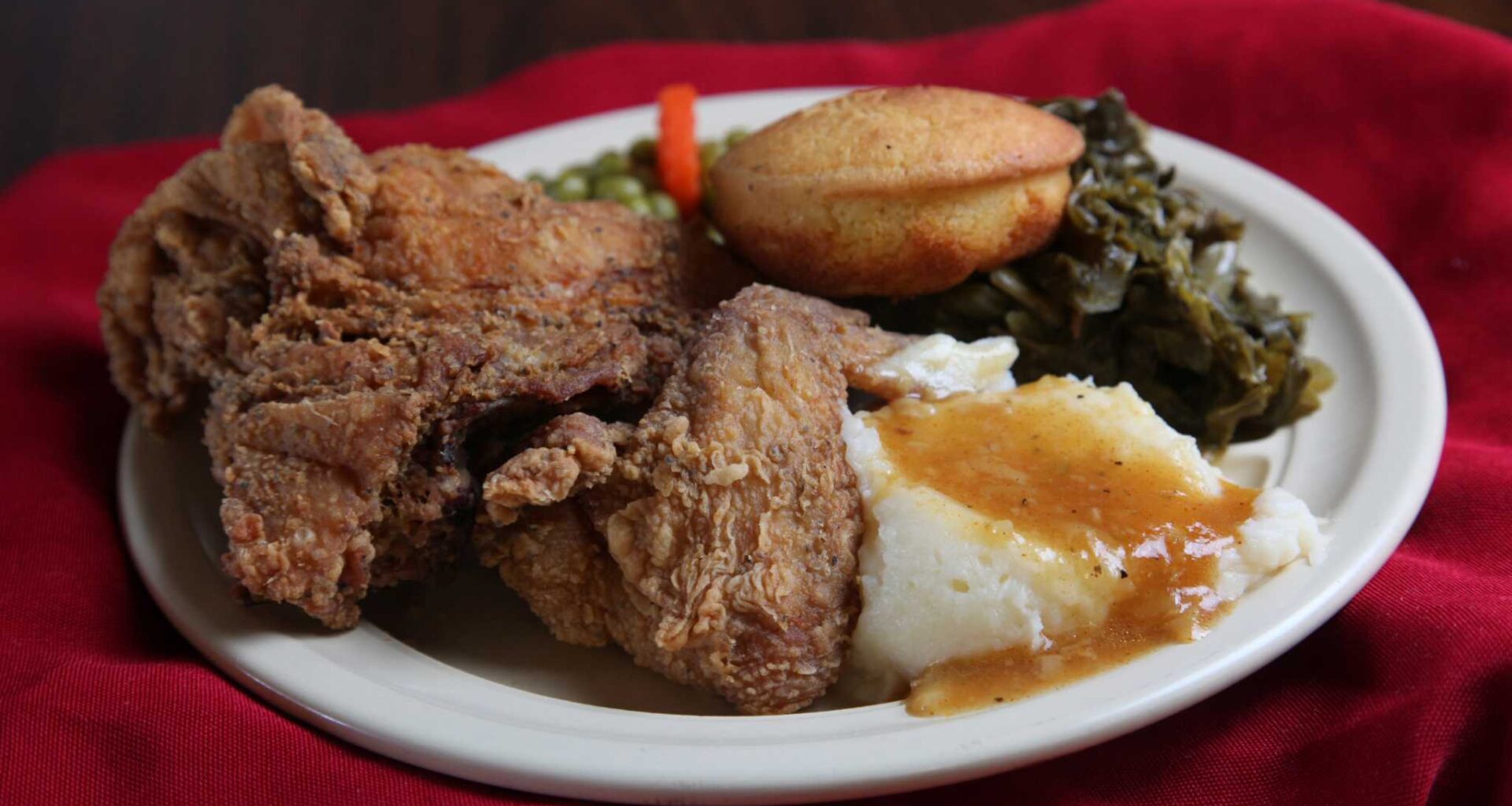 Fried chicken with mashed potatoes, green beans, green peas, carrots and cornbread from Mr. and Mrs. G's Home Cooking.