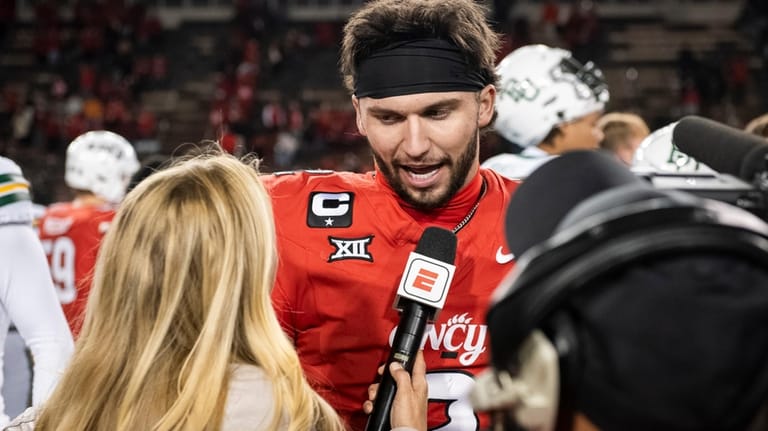 Cincinnati quarterback Brendan Sorsby (2) is interviewed after a NCAA...