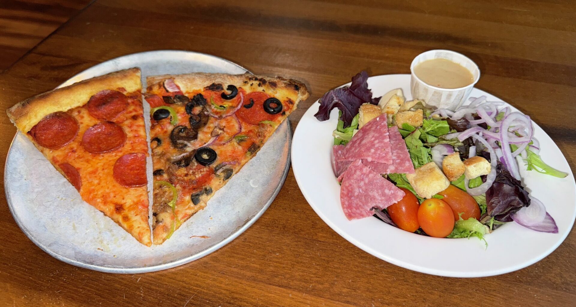 Bootleggers Pizza Parlor serves a pizza lunch special with salad and a drink in downtown New Braunfels, Texas.