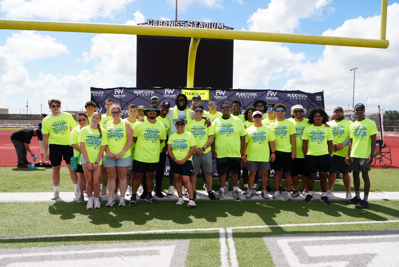 George Pickens with camp volunteers