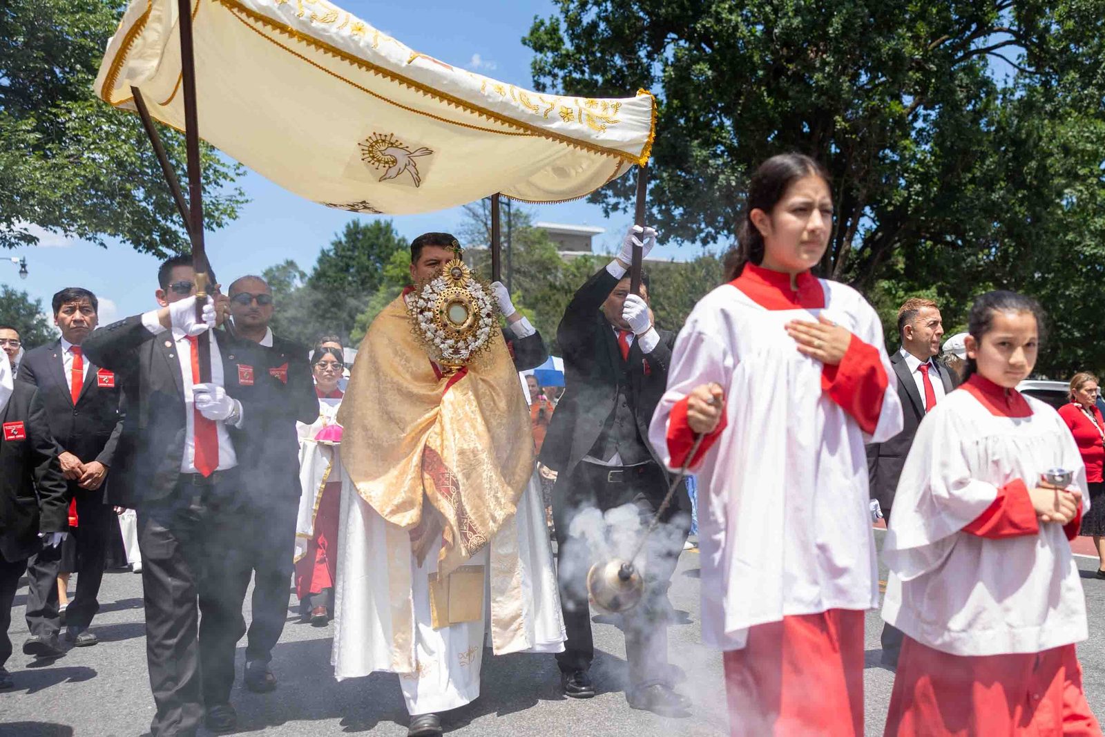Bishop Evelio Menjivar carries the Blessed Sacrament during a Corpus Christi procession from the Shrine of the Sacred Heart to the Cathedral of St. Matthew the Apostle on June 7 in Washington, D.C. Participants in the Eucharistic procession offered prayerful support and solidarity for immigrants and refugees. Bishop Menjivar, an auxiliary bishop of Washington since 2023, was appointed by Pope Leo XIV on May 1 to become the new bishop of Wheeling-Charleston, West Virginia, and he will be installed as bishop there on July 2. (Catholic Standard photo by Mihoko Owada)