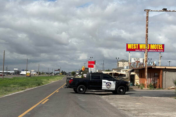 Law enforcement responds to an active shooting scene Friday, June 12, 2026, in Midland, Texas. (B. Kay Richter/Reporter-Telegram via AP)