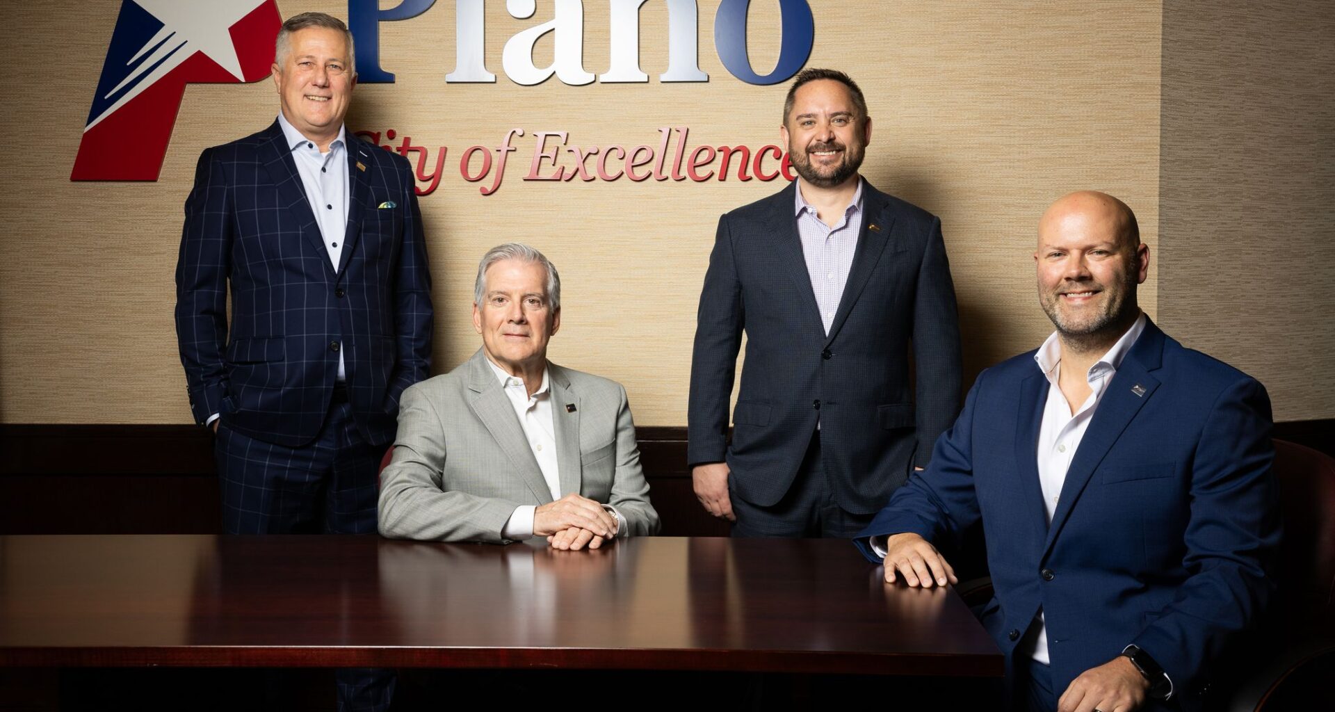 (From left) Plano City Manager Mark Israelson, Mayor John Muns, Deputy City Manager Doug McDonald and Economic Development Director Michael Talley pose for a photo at the Plano Municipal Center in Plano, TX, Friday, June 12, 2026.