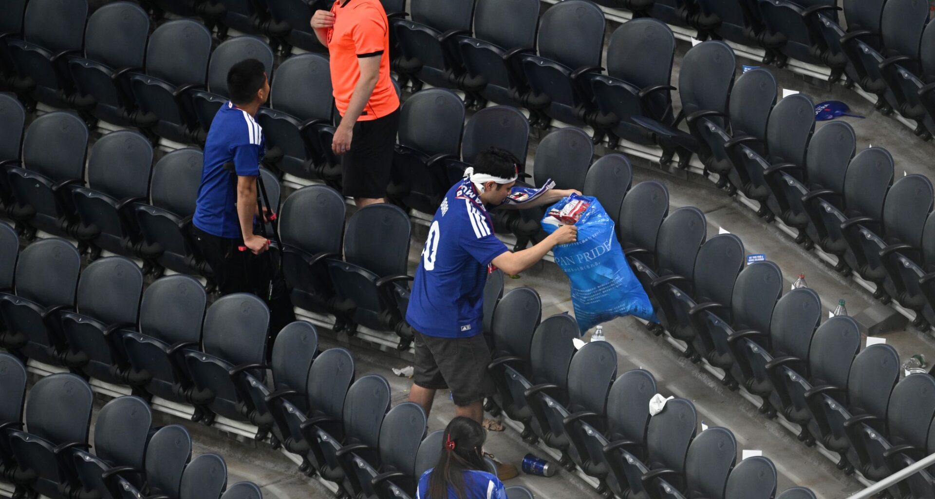 Japan fans use blue bags to uphold a cleansing World Cup tradition after draw
