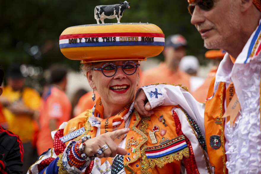 Juydo Janssen and ‘The Queen of Cheese’ dressed up in modified Dutch traditional outfits to symbolize the Netherlands and their team before the Netherlands and Japan World Cup game Sunday, June 14, 2026, in Arlington.