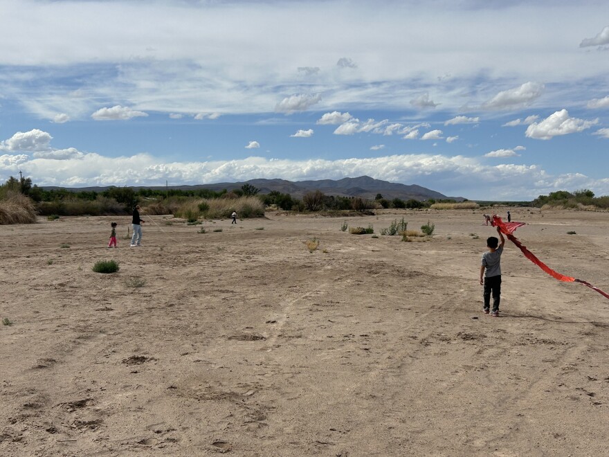 The Rio Grande is a river of sand most of the year in southern New Mexico. Here, kids fly kites in the dry riverbed in May.
