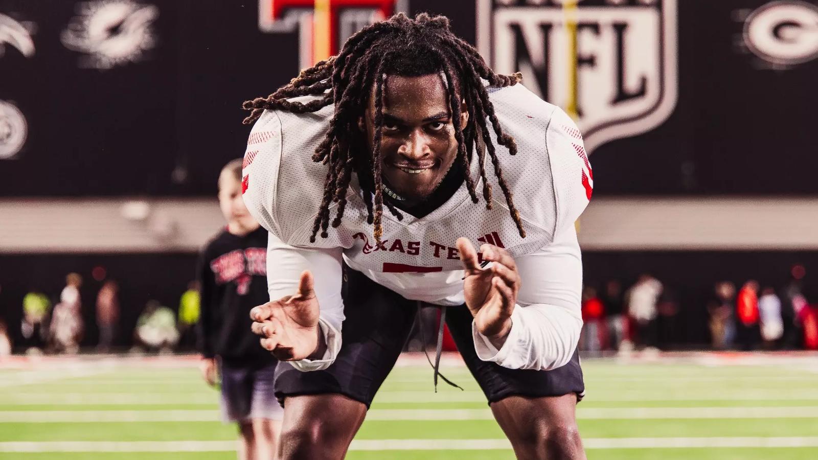 Kirby Hocutt smiles while talking to supporters on the sidelines prior to Texas Tech's 2025 opener versus UAPB.