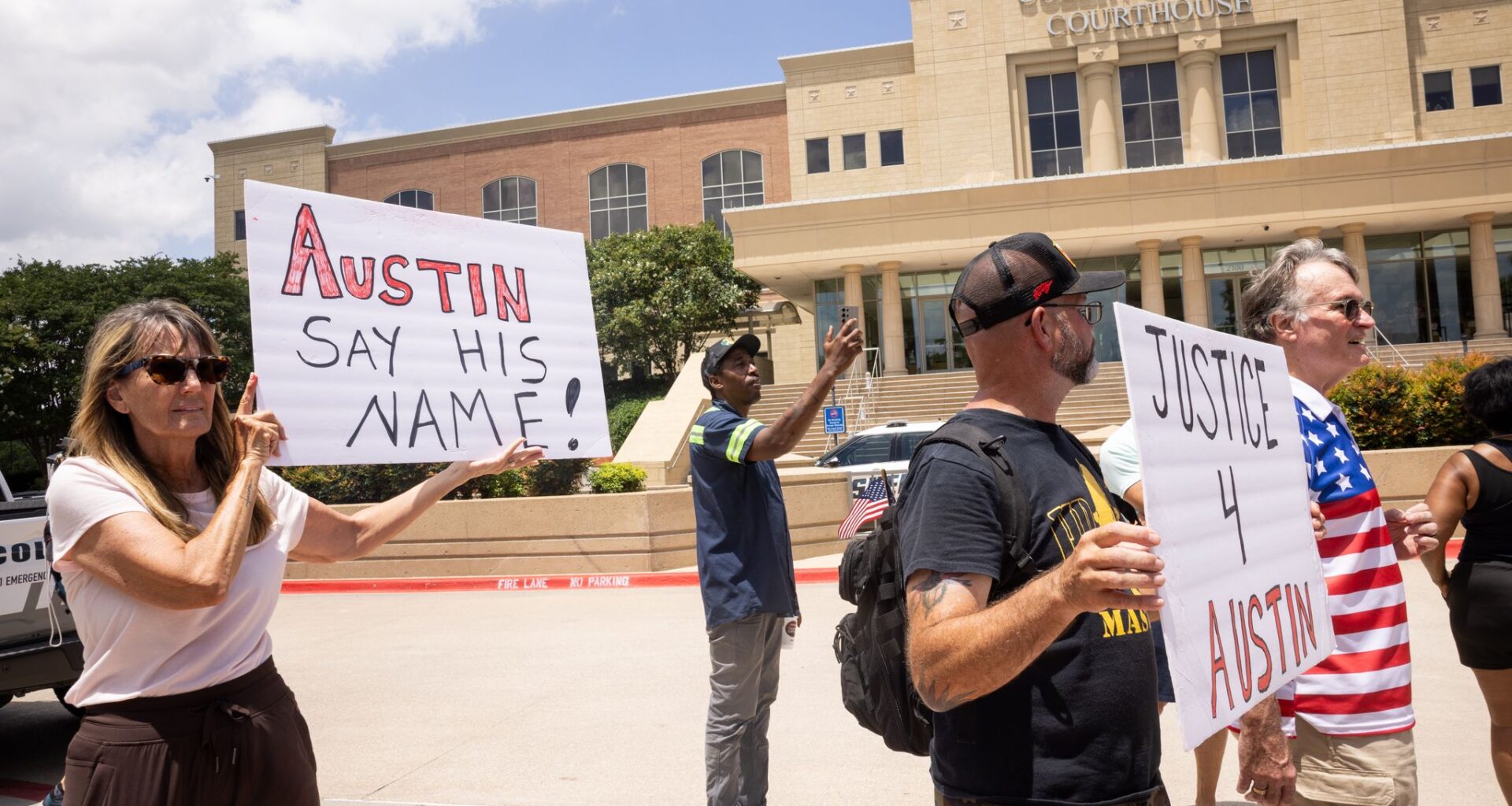 Supporters of Austin Metcalf hold signs before a verdict is announced in Karmelo Anthony’s murder trial outside of the Collin County Courthouse in McKinney, TX, Tuesday, June 9, 2026. The Collin County jury found Karmelo Anthony guilty of murder in the fatal stabbing of 17-year-old Metcalf last April at a Frisco track meet at David Kuykendall Stadium.