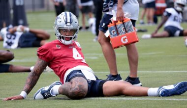 With his personal goals tattooed on his forearm, Dallas Cowboys head coach Brian Schottenheimer listens to a question from a media member during a press conference prior to the start of team OTA practice sessions held at The Star in Frisco on June 9, 2026.