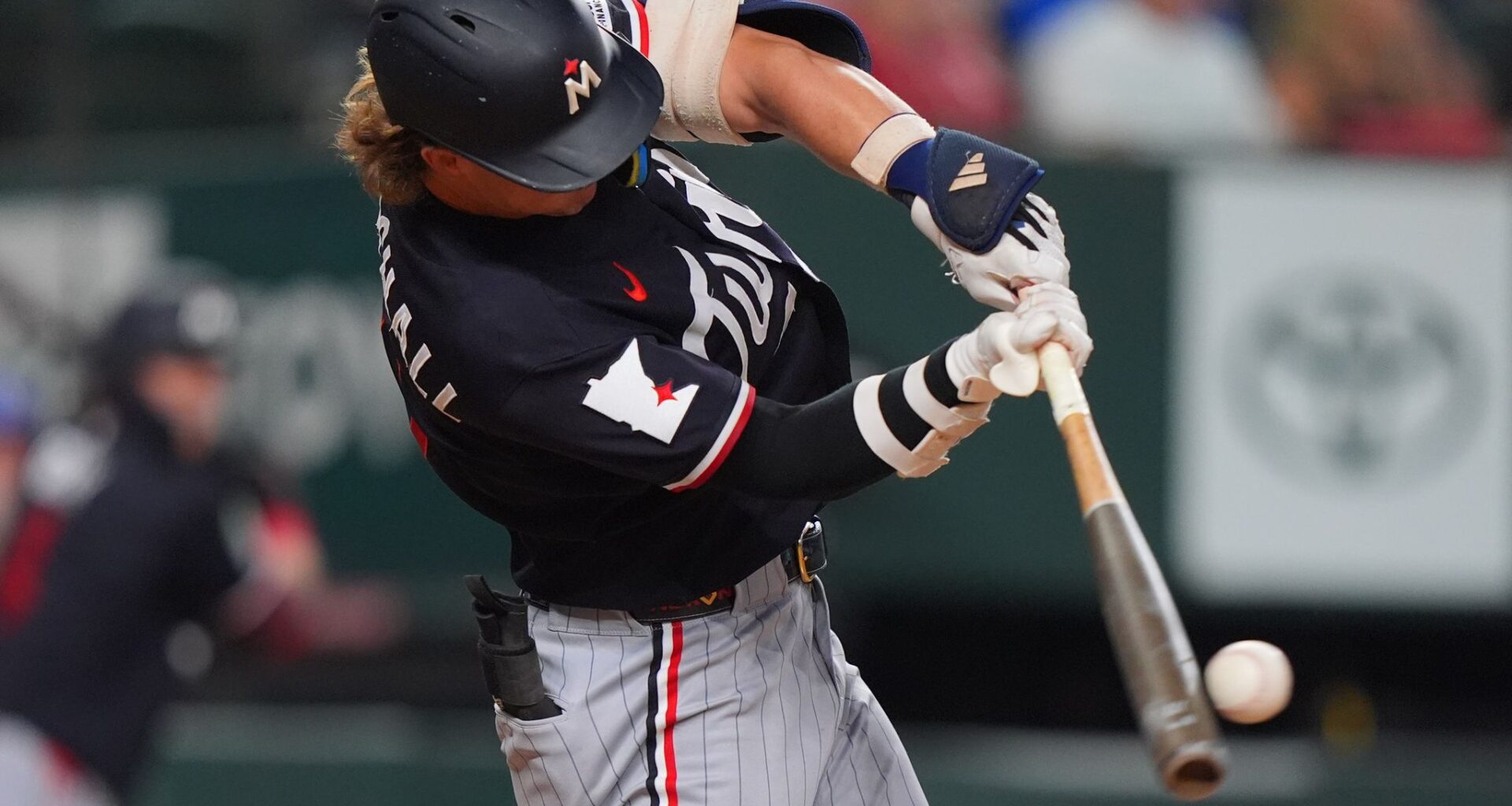 Larnach leads off with homer and Twins go on to 12-2 win to clinch another series in Texas