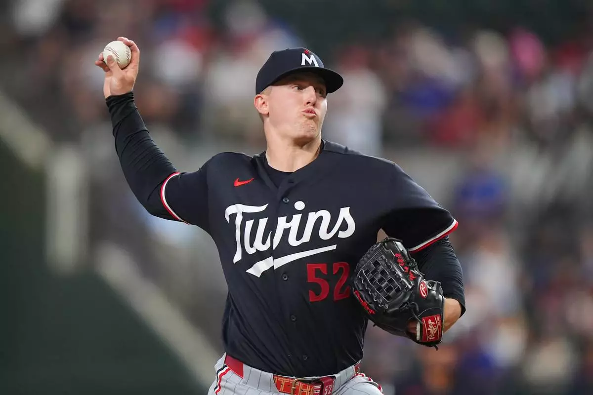Minnesota Twins starting pitcher Zebby Matthews throws during the first inning of a baseball game against the Texas Rangers, Tuesday, June 16, 2026, in Arlington, Texas. (AP Photo/LM Otero)