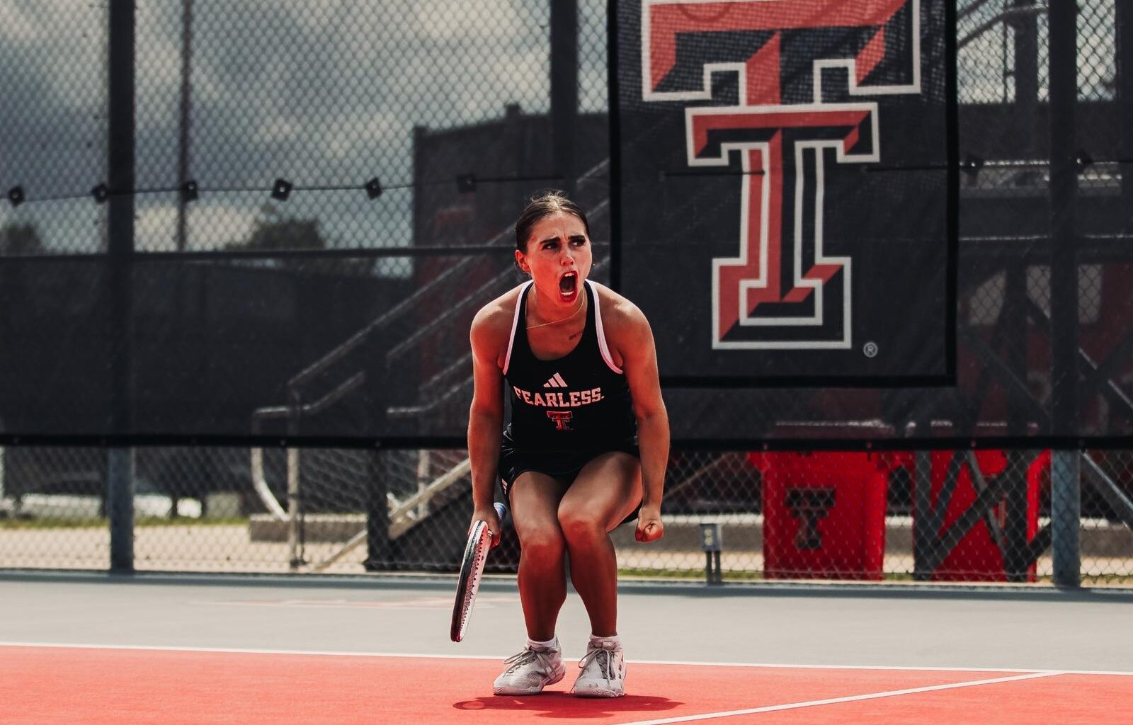 Yekaterina Dmitrichenko hits a forehand against Texas.