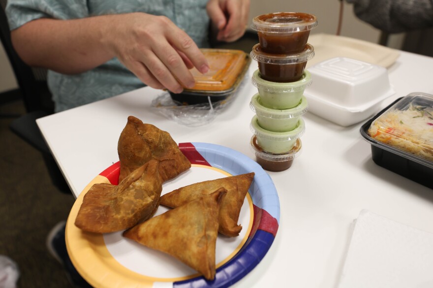 Samosas sit on a table during a recording for ATXplained Live at the KUT studios on Thursday, Sept. 18, 2025.