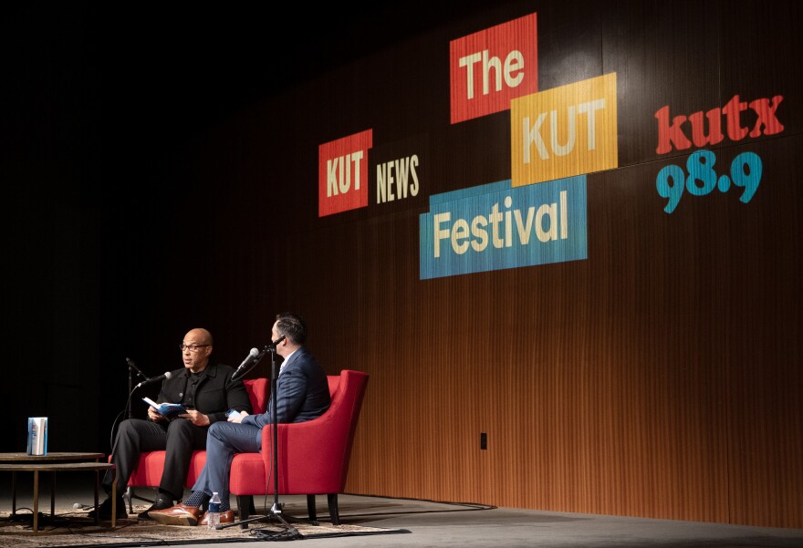 Cory Booker and Domenico Montenaro talk on a stage at the LBJ Presidential Library during the opening night of the KUT Festival.