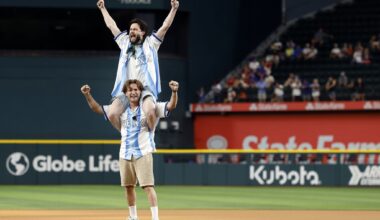 Highly popular British internet duo Woody & Kleiny react after throwing out the ceremonial first pitch before the Texas Rangers game against the Minnesota Twins at Globe Life Field in Arlington, June 16, 2026. Paul Wood (bottom) and Paul Klein are continuously streaming their lives to millions around the globe.