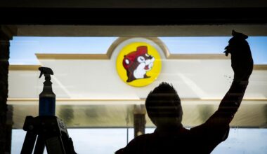 Sean Mizell washes windows for the opening of the Buc-ee’s in Terrell — the better to gaze out at the store’s 84 gas pumps and 19 acres of land, or to look in from outside at the 60,000 square feet of floor space.