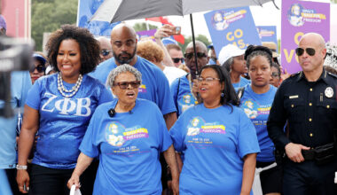Opal Lee, the Grandmother of Juneteenth, second from left, walks through Fair Park with her granddaughter Dione Sims, third from left and hundreds of participants during 2024 Opal's Walk for Freedom honoring the U.S. federal holiday, Juneteenth, Wednesday, June 19, 2024, in Dallas.