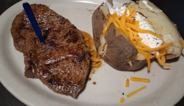 The house steak with a baked potato at the Hungry Farmer Steakhouse.