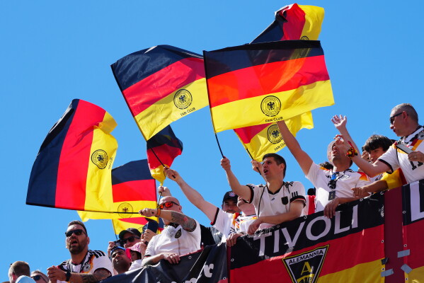 Germany fans sing their national anthem and wave flags before the World Cup Group E soccer match between Germany and Ivory Coast in Toronto, Saturday, June 20, 2026. (Frank Gunn/The Canadian Press via AP)